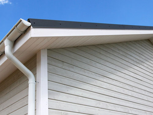 Corner view of a roof with a gutter