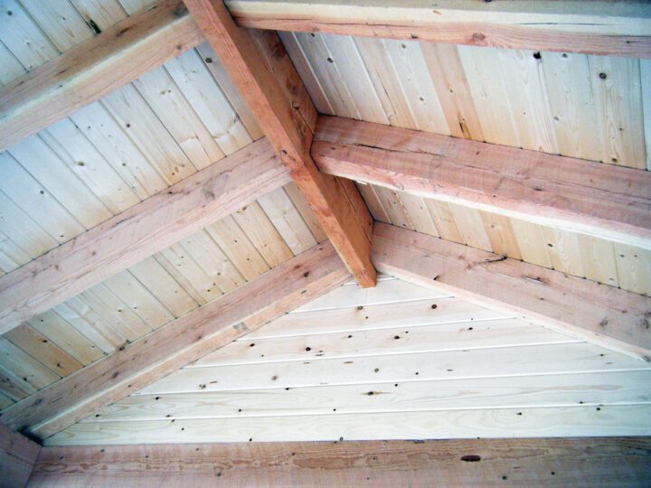 Inner view of custom wooden beams on a ceiling