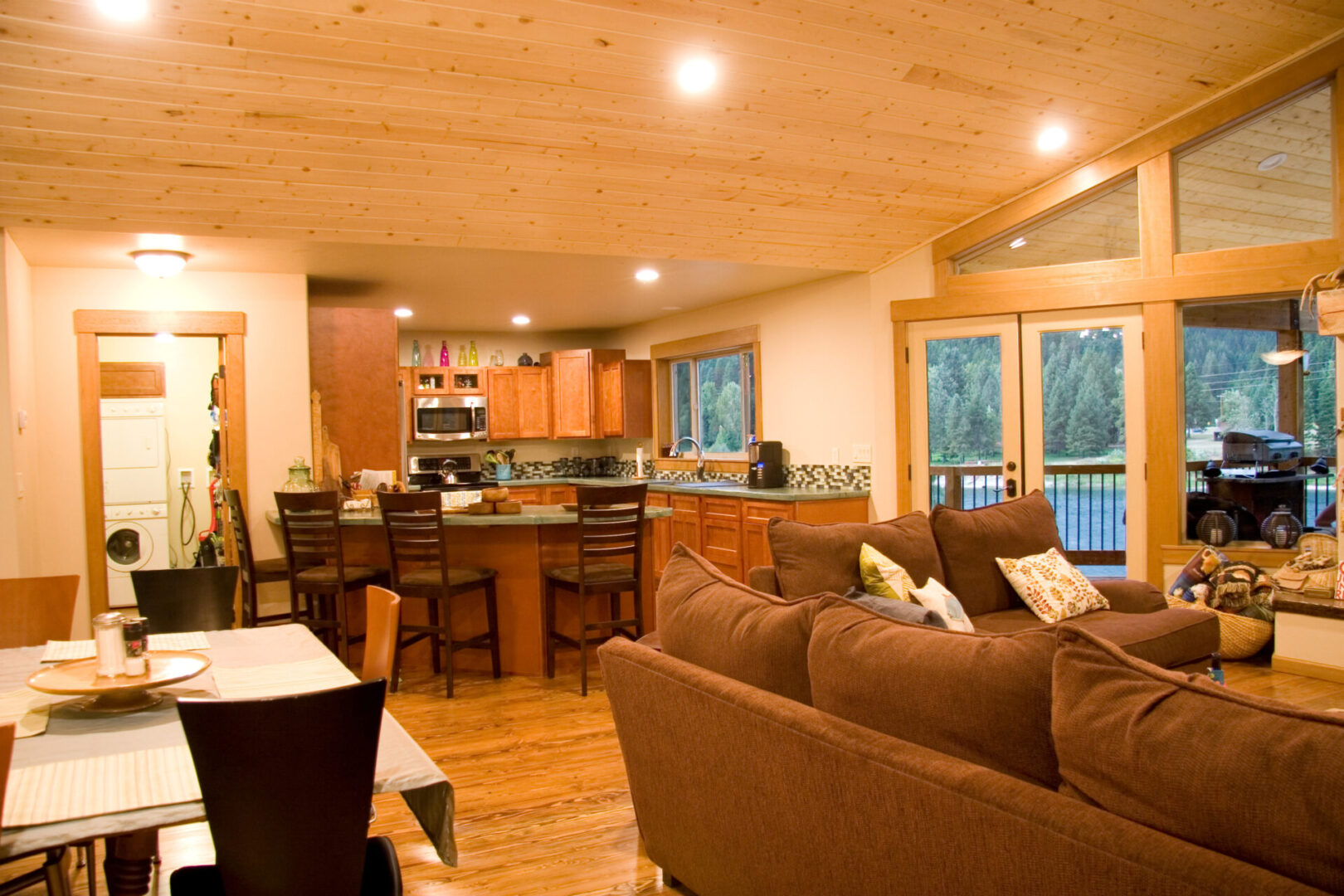 Wooden-themed residential floor with living space, kitchen, and dining areas 