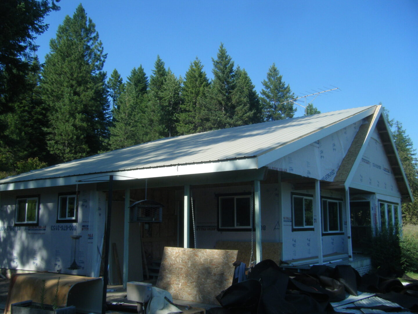 Side view of a bungalow home being remodeled