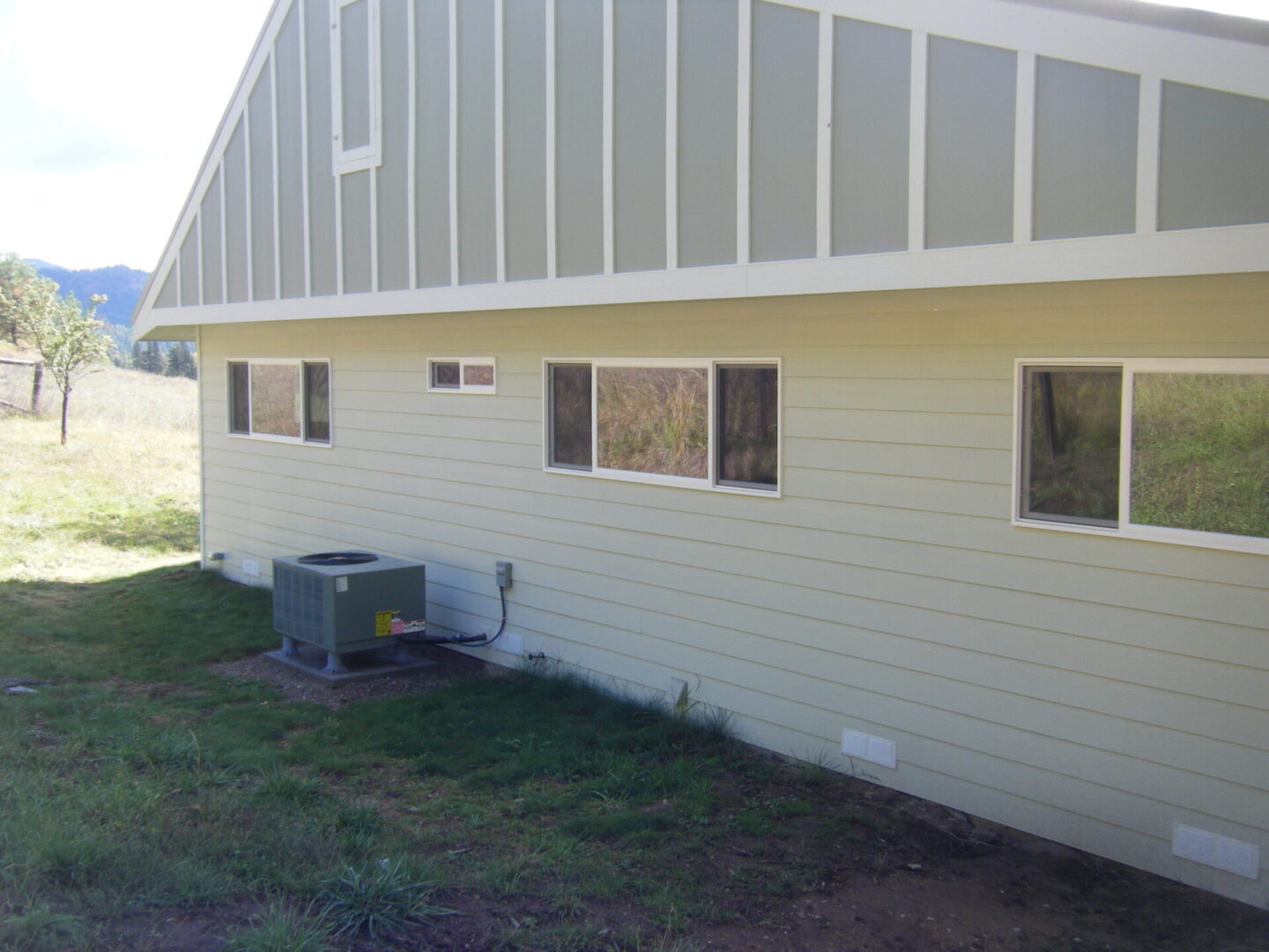 Outer view of a house with an installed HVAC system