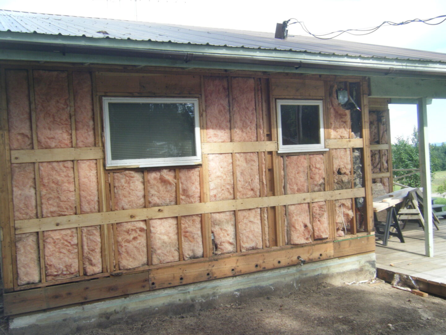 Front view of house walls being remodeled