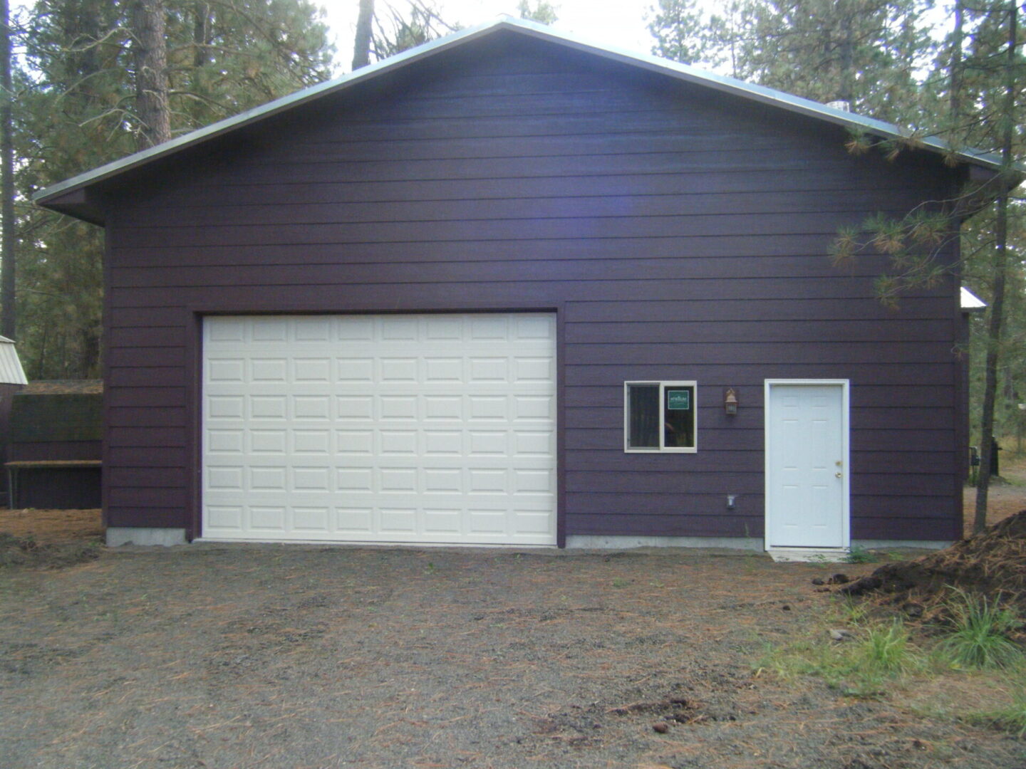 Brown house with a garage