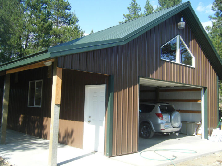 Side view of a brown house with a garage and a car