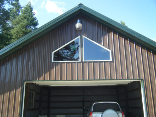 Close-up view of a brown garage with a roof